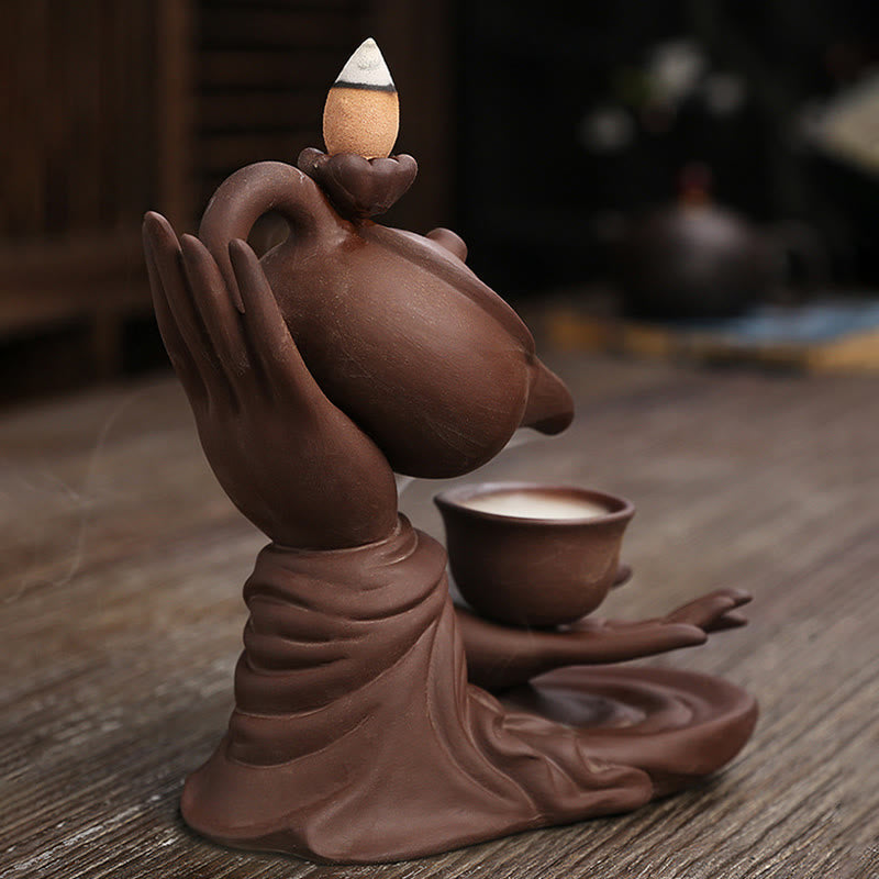 Buddha Hand Teapot Incense Burner – Two hands in mudra hold teapot and cup, no smoke yet, terracotta