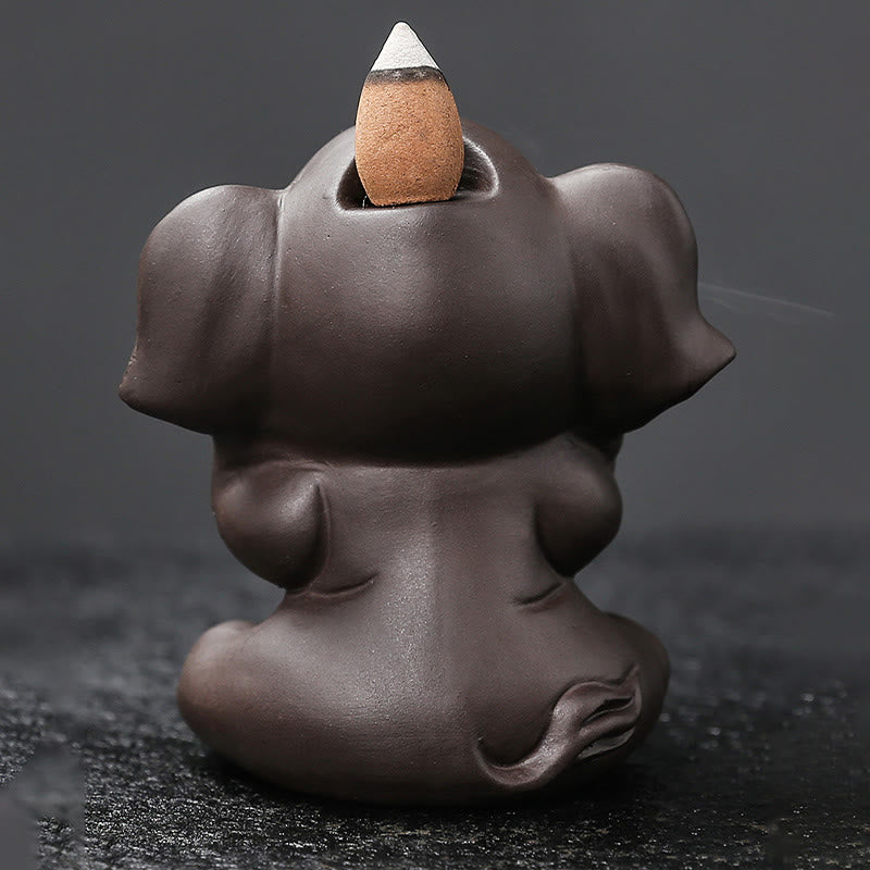 Cute Elephant Incense Burner – Elephant with smoke from mouth pooling at base, dark ceramic