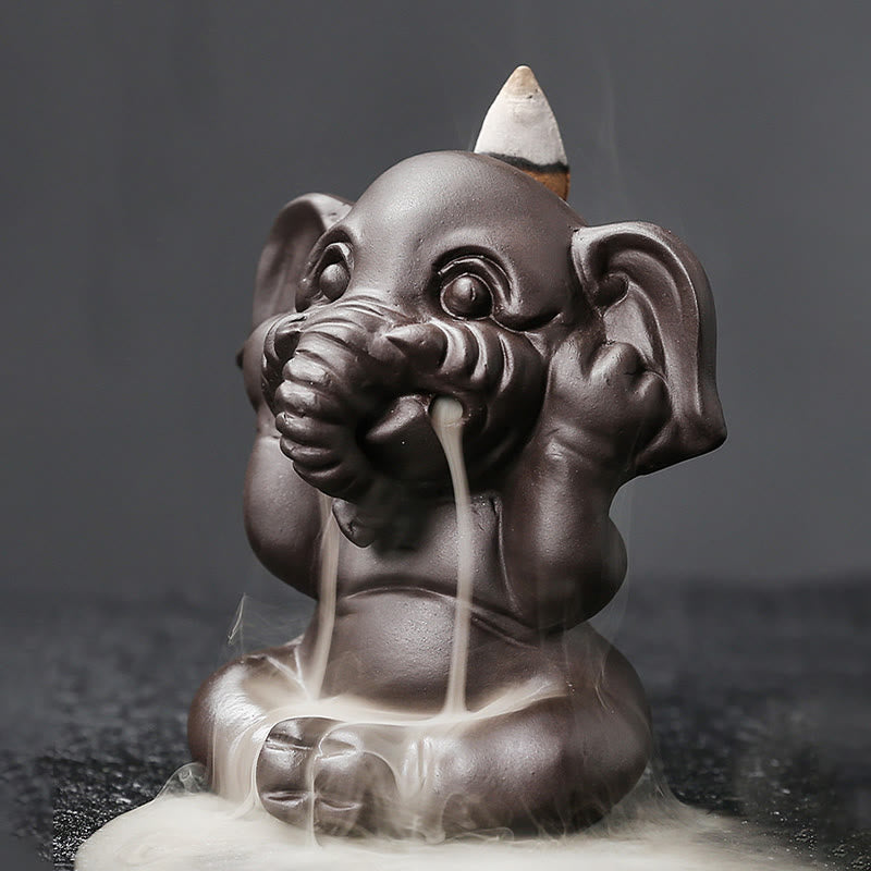 Cute Elephant Incense Burner – Split view of cone slot with incense and empty hole, mechanism