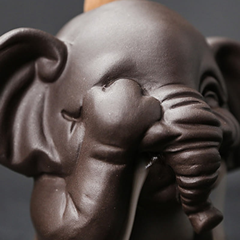 Cute Elephant Incense Burner – Front view, winking elephant with curled trunk, cross-legged pose