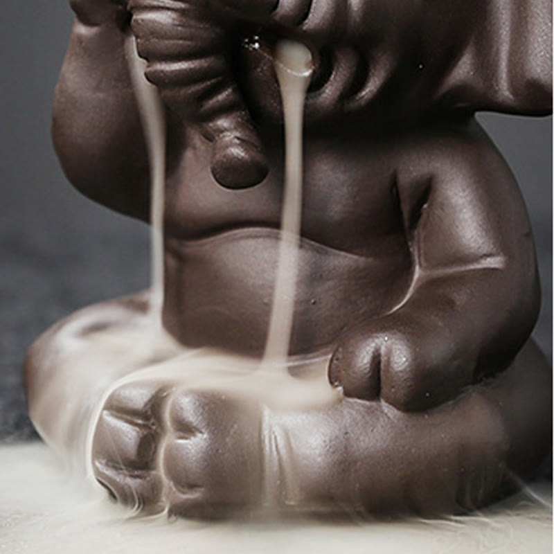 Cute Elephant Incense Burner – Close-up of elephant face, smoke from trunk, closed eyes, backflow