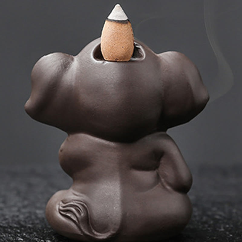 Cute Elephant Incense Burner – Close-up lit cone in holder, three-tone burn, ceramic detail
