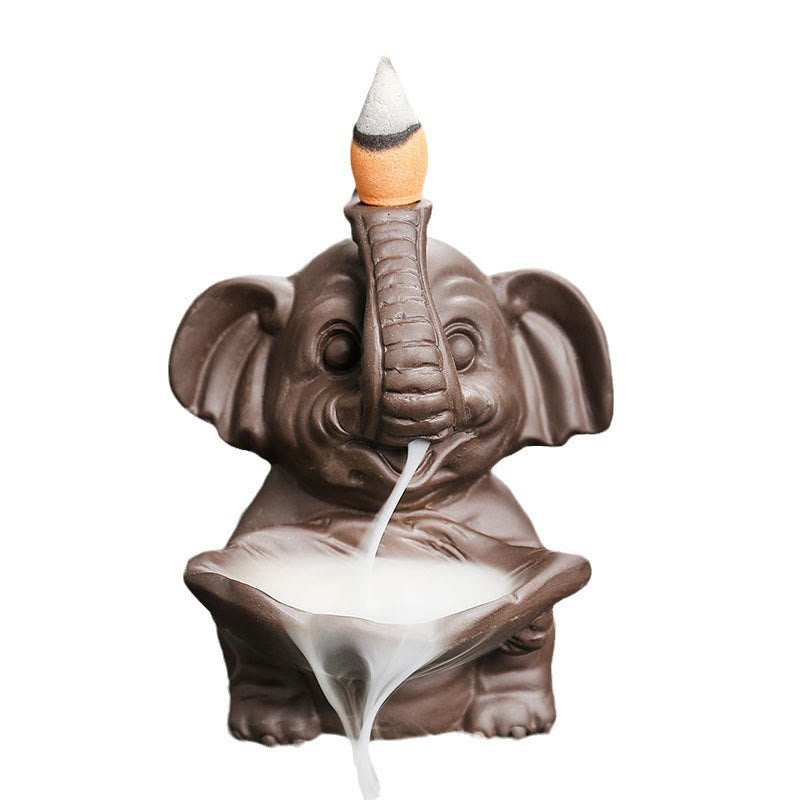 Elephant Backflow Incense Burner - White background with active smoke waterfall effect, purple clay censer