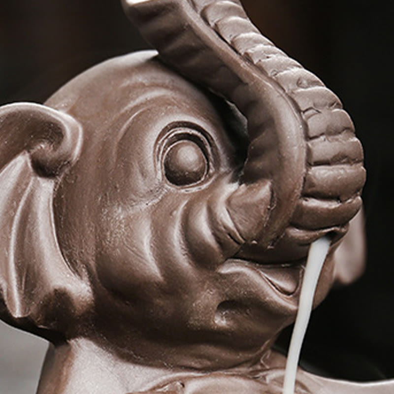 Elephant Backflow Incense Burner - Macro of trunk with smoke demonstrating tea pet function, purple clay censer