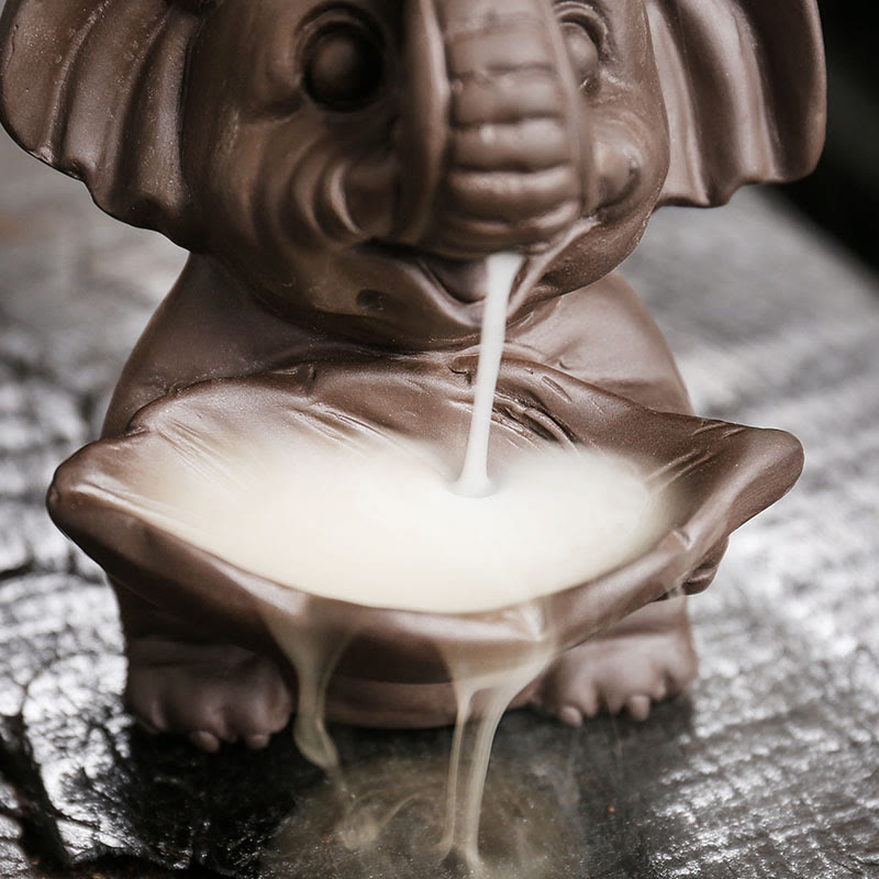 Elephant Backflow Incense Burner - Close-up of bowl overflowing with smoke waterfall, purple clay censer