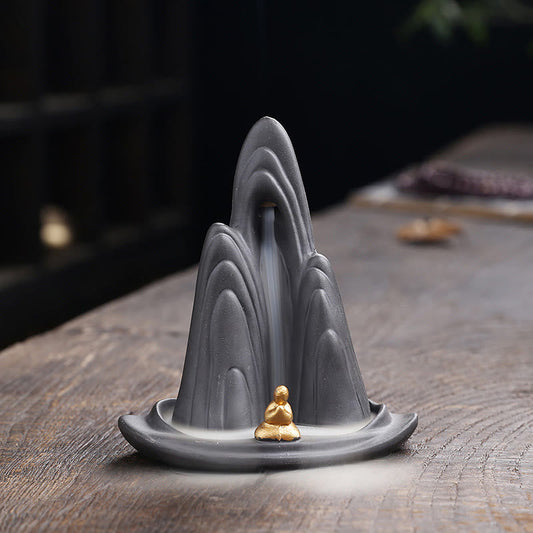 Little Monk Purple Clay Backflow Incense Burner - Gray mountain with gold monk and smoke waterfall, backflow incense