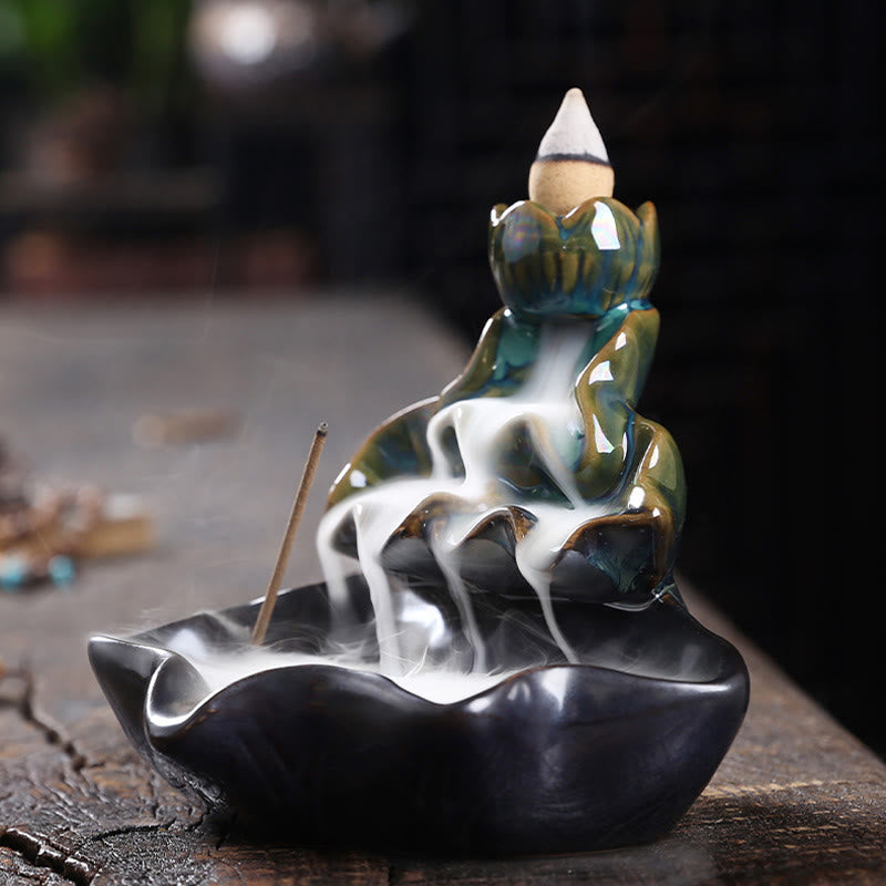 Lotus Leaf Koi Fish Incense Burner – blue-green lotus bud with incense stick on wood, meditation