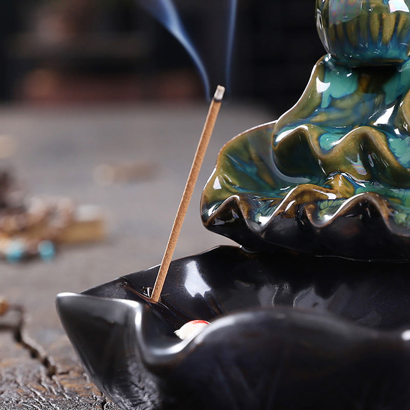 Lotus Leaf Koi Fish Incense Burner – teal black lotus with koi, incense stick smoke, macro decor