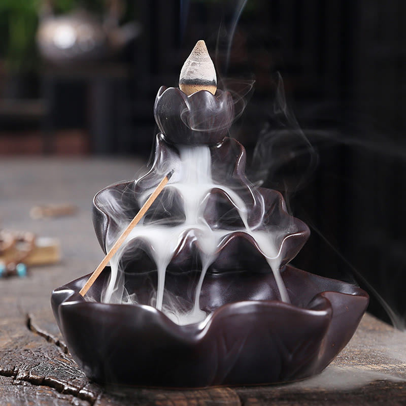 Lotus Leaf Koi Fish Incense Burner – dark brown cascading lotus, smoke waterfall, moody foliage, backflow