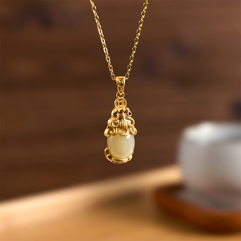 White Jade Pixiu Wealth Luck Pendant Necklace – hanging jade Pixiu pendant with gold bail against wood background, prosperity talisman