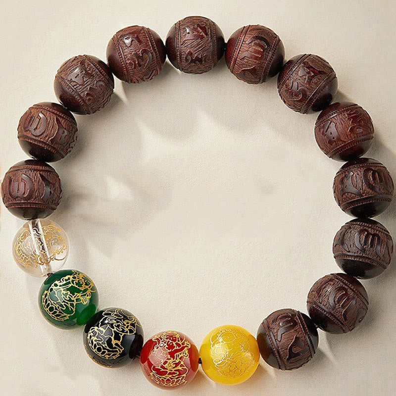 Five Directions Wealth Bracelet - Top-down view of carved sandalwood bracelet with five-element colored gemstone beads