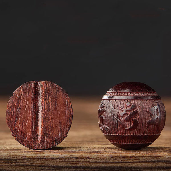 Five Directions Wealth Bracelet - Side and front view of carved sandalwood beads on rustic wood, craftsmanship detail