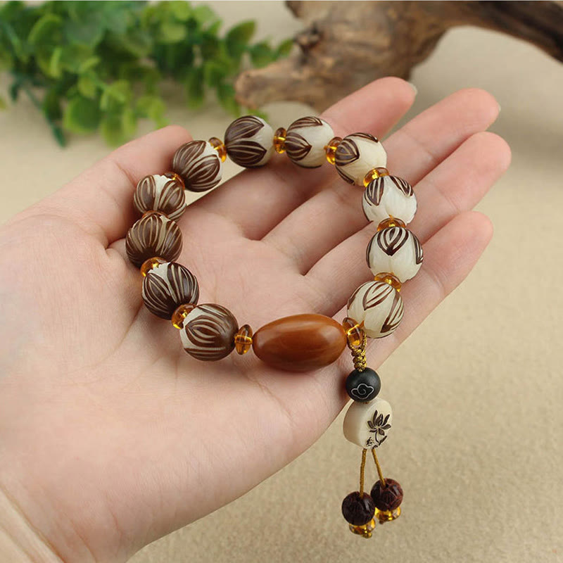 Tibetan Mala Bodhi Seed Lotus Bracelet - in open palm, lotus beads, natural wearing style
