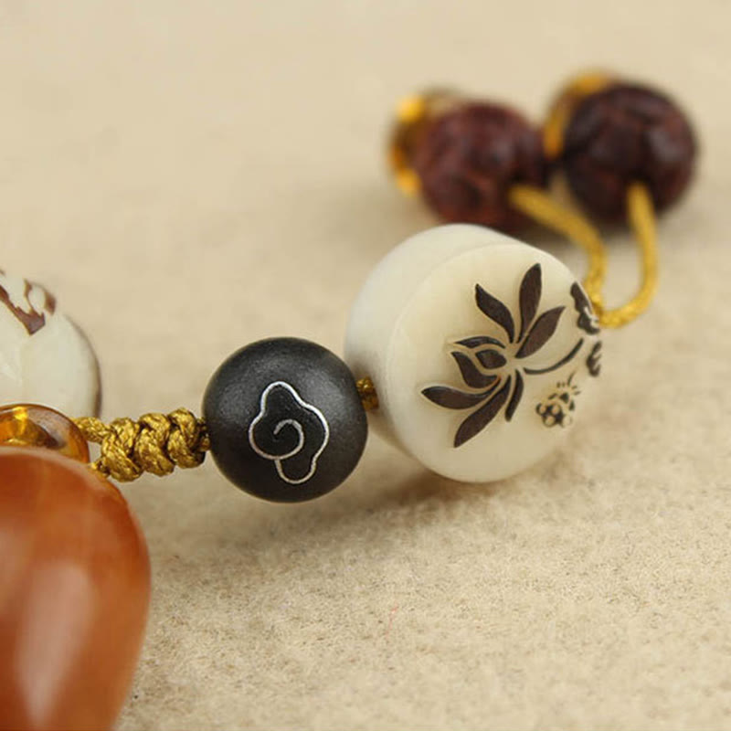 Tibetan Mala Bodhi Seed Lotus Bracelet - macro lotus disc charm, gold cord knotting, detailed