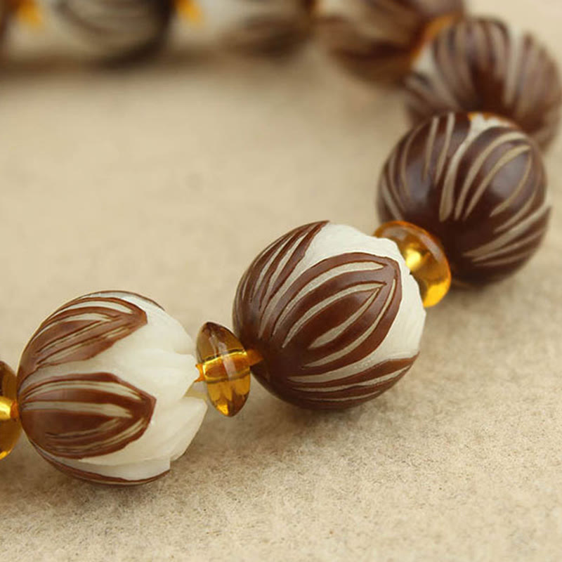 Tibetan Mala Bodhi Seed Lotus Bracelet - macro carved lotus beads, amber spacer detail