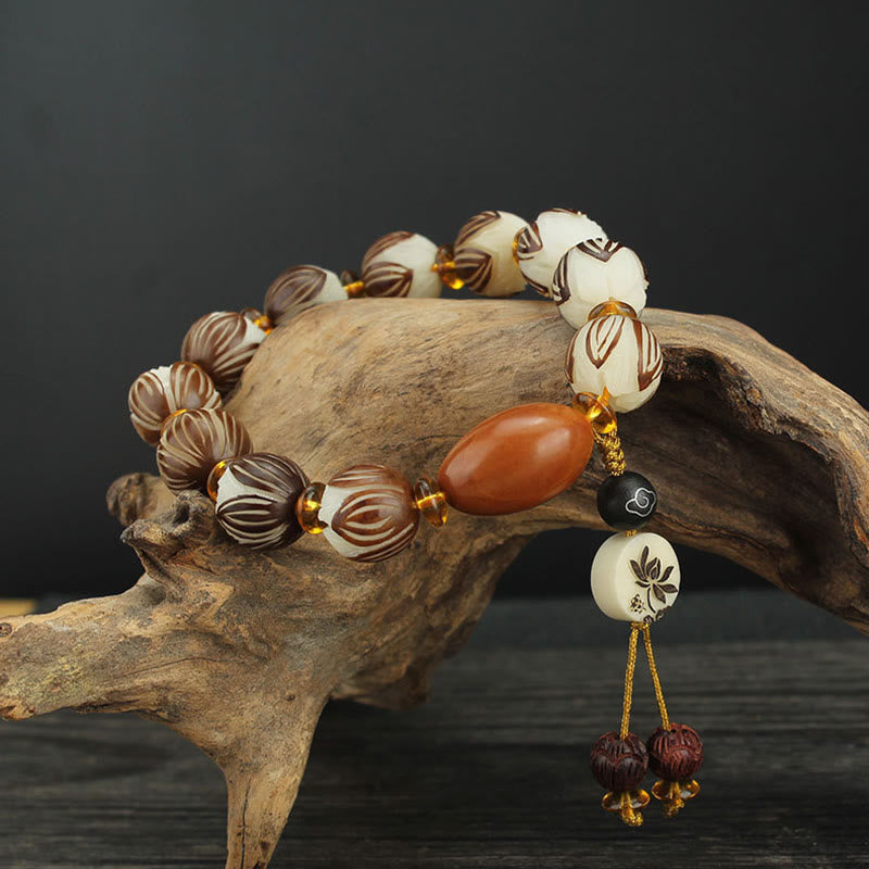 Tibetan Mala Bodhi Seed Lotus Bracelet - on driftwood, carved lotus beads with tassel, zen