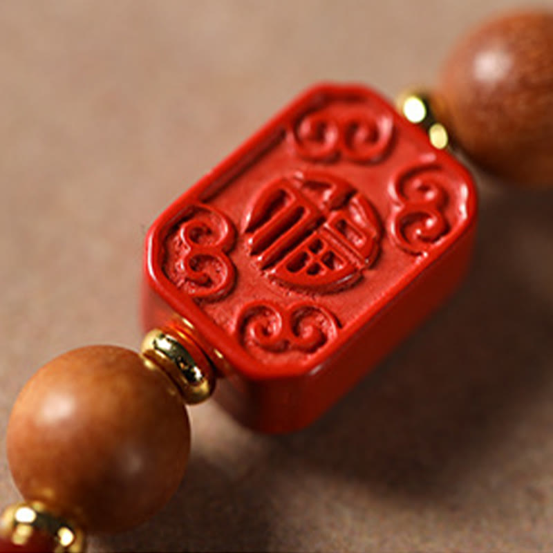 Cinnabar Wood Lotus Fu Bracelet - macro Fu character carving detail, cinnabar red, authentic