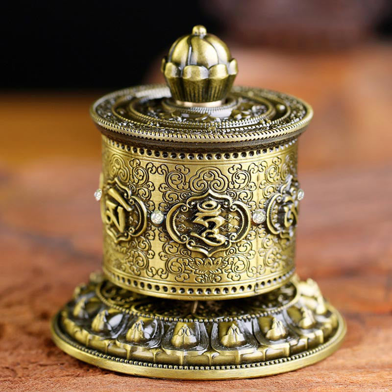 Lotus Prayer Wheel - Ornate brass mani wheel with lotus finial on wood, spiritual peace decor Image principale du produit