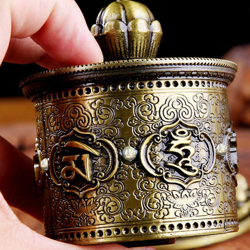 Lotus Prayer Wheel - Handheld brass wheel with Tibetan Om script, portable Buddhist practice