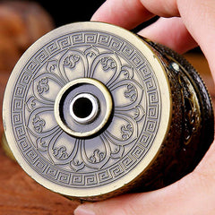 Lotus Prayer Wheel - Top-down view of engraved lotus mandala and meander border, craftsmanship