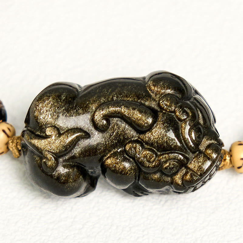 Gold Sheen Obsidian PiXiu bracelet – worn on wrist lifestyle shot, gold sheen obsidian feng shui