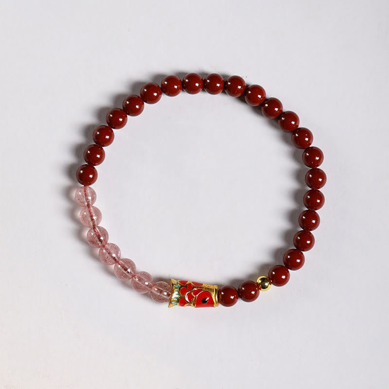 Cinnabar Strawberry Quartz Koi Fish Bracelet – top-down flat lay, cinnabar pink beads, koi
