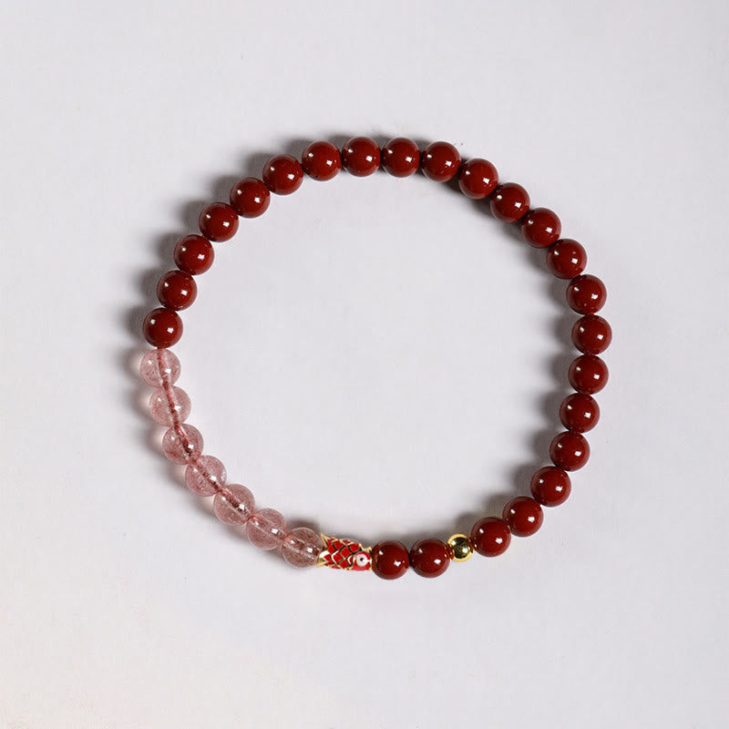 Cinnabar Strawberry Quartz Koi Fish Bracelet – flat lay, cinnabar pink beads, koi right-facing
