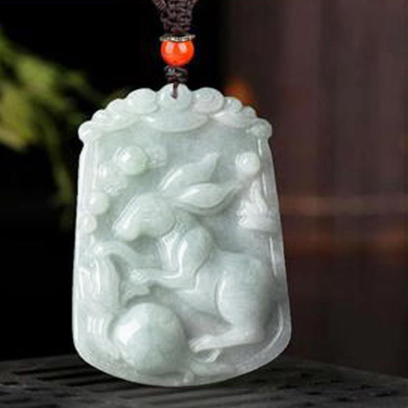 Natural Jade Zodiac Amulet Pendant – Rabbit floral jade pendant on carved wood stand detail, Gentle
