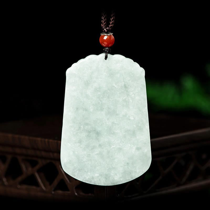 Natural Jade Zodiac Amulet Pendant – Frontal view jade plaque on dark wood with red agate bead knot, Auspicious