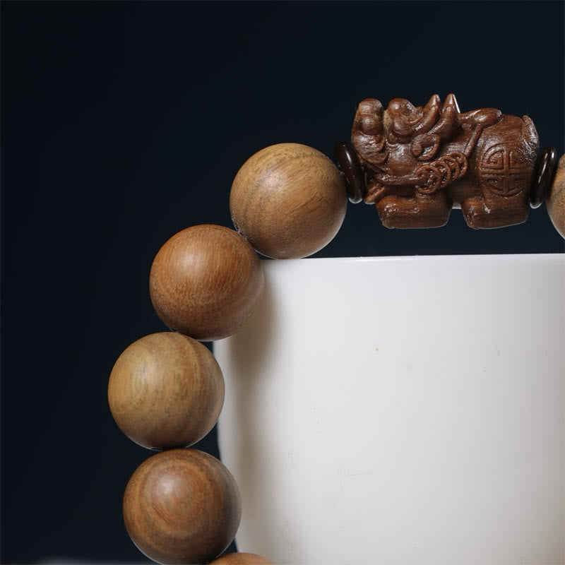 Green Sandalwood Pixiu Attract Wealth Bracelet – macro black bg cup prop pixiu, Luxurious