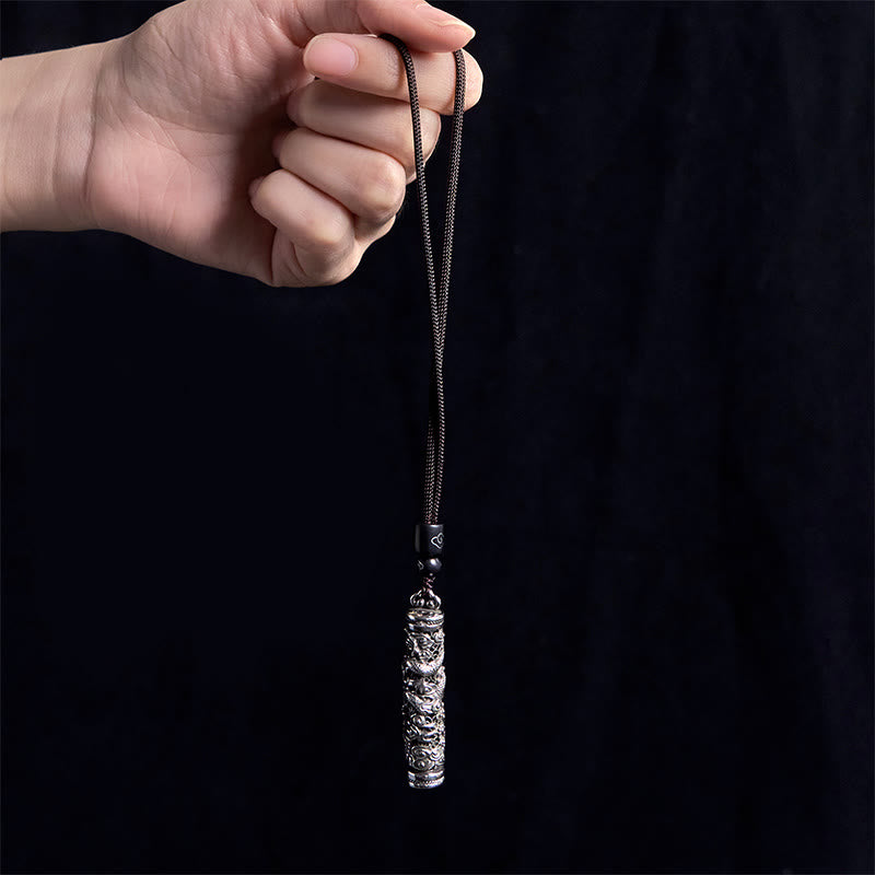 Copper Dragon Fu Character Pendant – silver cylinder held by hand on black, Luck