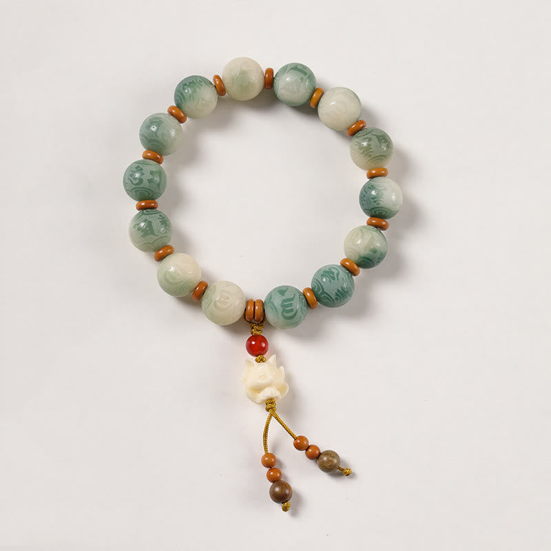 Bodhi Seed Zakiram Bracelet - Elevated white angle showing lotus pendant and alternating bead pattern, wrist mala