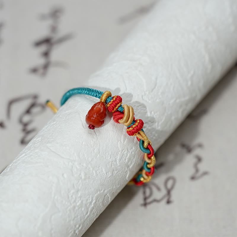 Natural Red Agate PiXiu Braided Bracelet – on white scroll calligraphy background, good luck braided cord