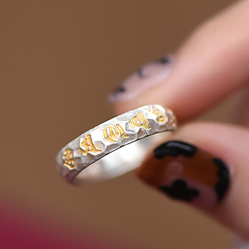 Hammered Om Mani Padme Hum Ring - hand model with dark manicure, gold script silver band