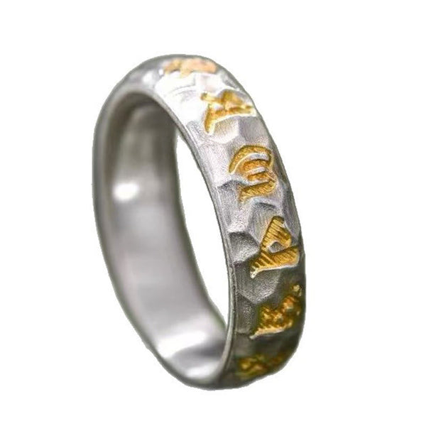 Hammered Om Mani Padme Hum Ring - isolated on white with gold Tibetan characters, spiritual ring