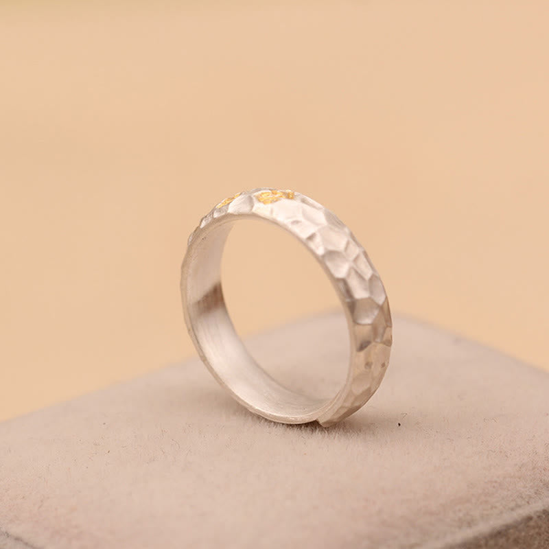 Hammered Om Mani Padme Hum Ring - flat lay on gray velvet, handcrafted gold silver ring