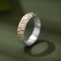 Hammered Om Mani Padme Hum Ring - angled view showing four gold Sanskrit characters, artisan mantra band