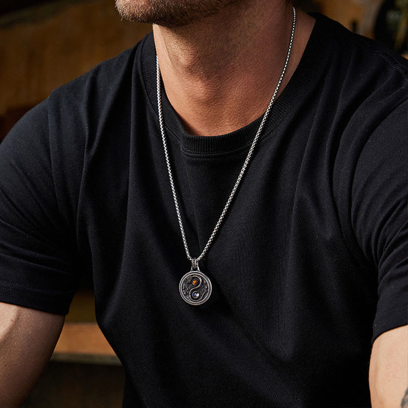 Snake Yin Yang Necklace - Men's yin-yang pendant with orange and dark stone inlays on twisted rope chain, model lifestyle sho