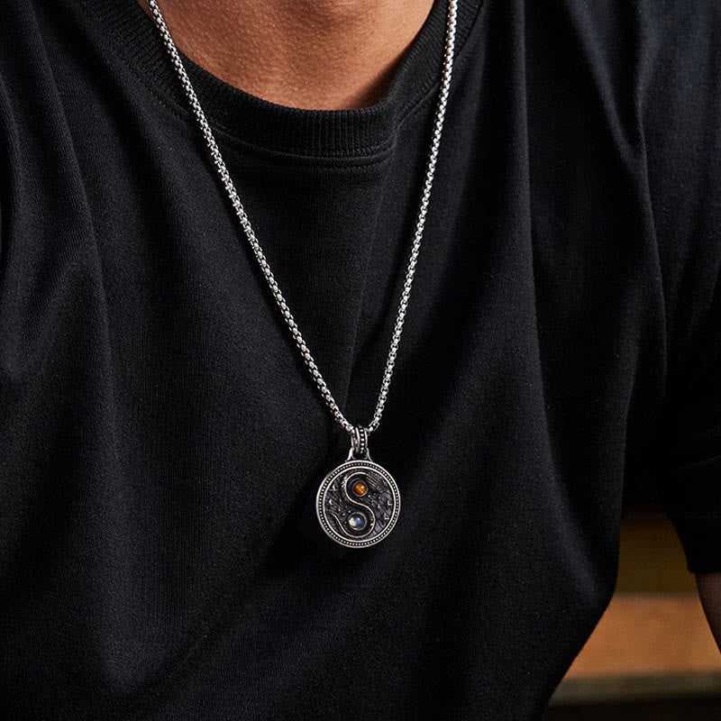 Snake Yin Yang Necklace - Silver yin-yang pendant with amber and blue gemstone inlays on model, balance symbol necklace