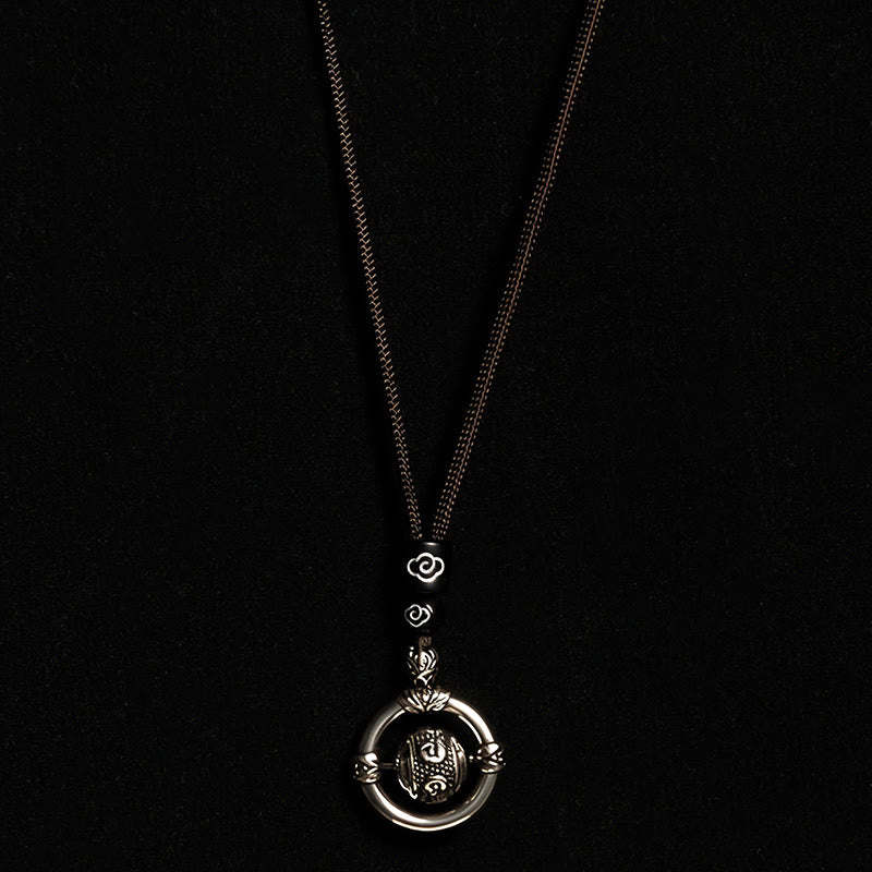 Om Mani Padme Hum Pendant – Hanging vertically on black background displaying full chain and lotus connector, mantra necklace