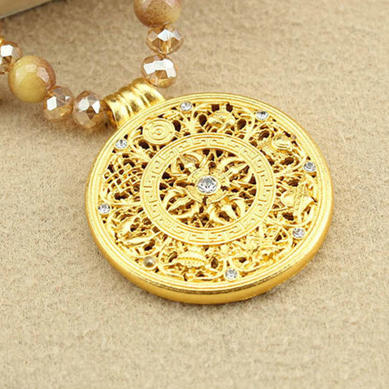 Dharma Wheel Tiger Eye Pendant – gold filigree with 8 crystals, courage necklace