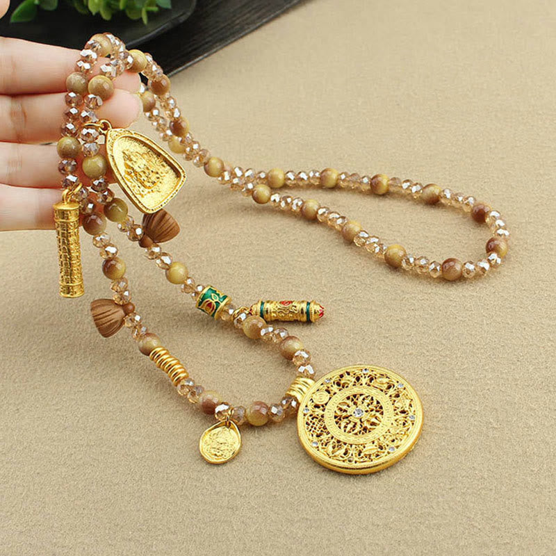 Golden Tiger Eye Necklace – held in hand showing layered beads, courage necklace