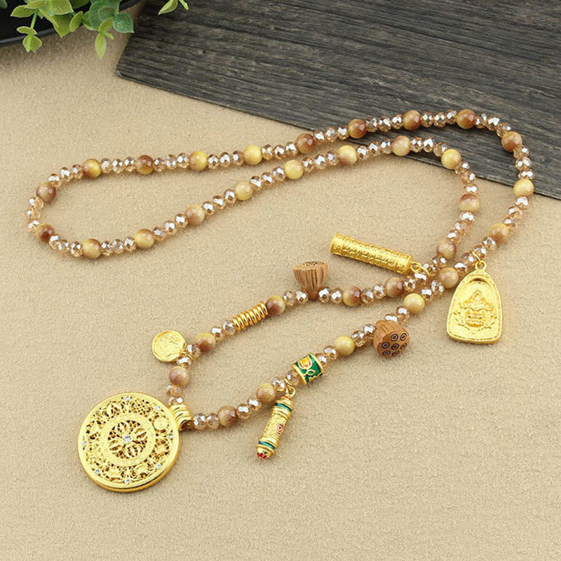 Tibetan Lotus Tiger Eye Necklace – mandala pendant on beige fabric, strength jewelry