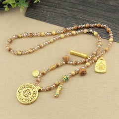 Tibetan Lotus Tiger Eye Necklace – mandala pendant on beige fabric, strength jewelry