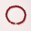 Natural Red Agate Koi Fish Bracelet – red agate beads with gold koi charm, top-down, confidence