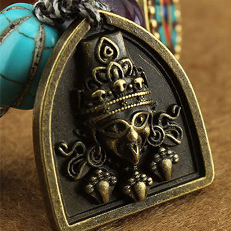 Tibetan Zakiram Turquoise Lotus Rope Bracelet – close-up Garuda deity pendant with turquoise bead on cord, Zakiram