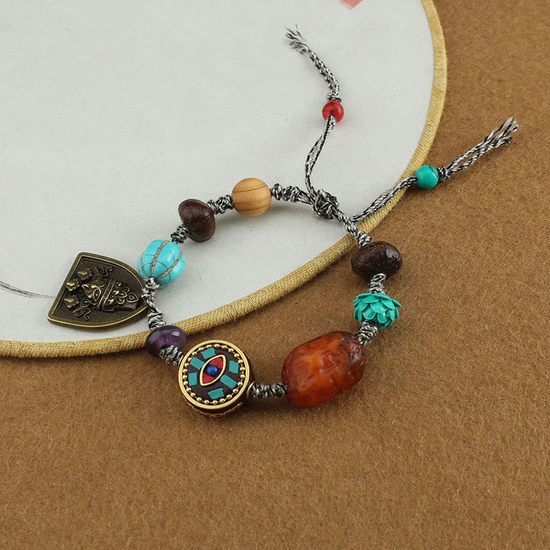 Tibetan Zakiram Turquoise Lotus Rope Bracelet – on embroidery hoop prop with sliding knot and cord detail, Adjustable