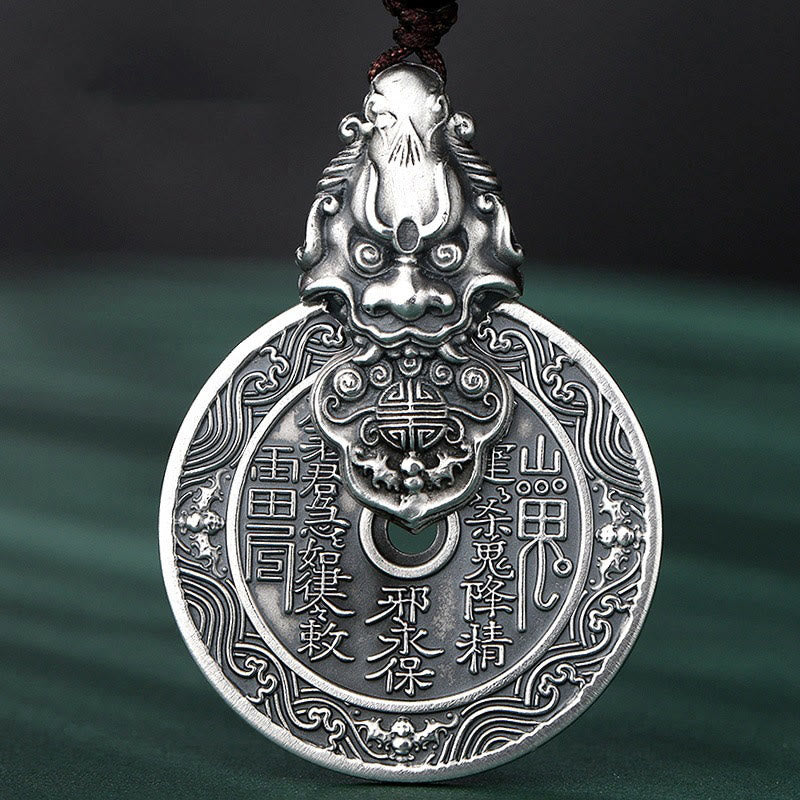 Mountain Ghost Bagua Copper Pixiu Necklace – front close-up dark green background engraved symbols, copper amulet