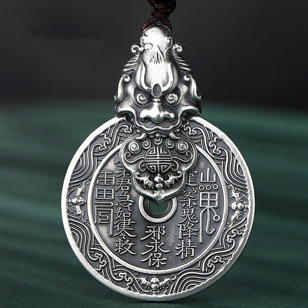 Mountain Ghost Bagua Copper Pixiu Necklace – front close-up dark green background engraved symbols, copper amulet