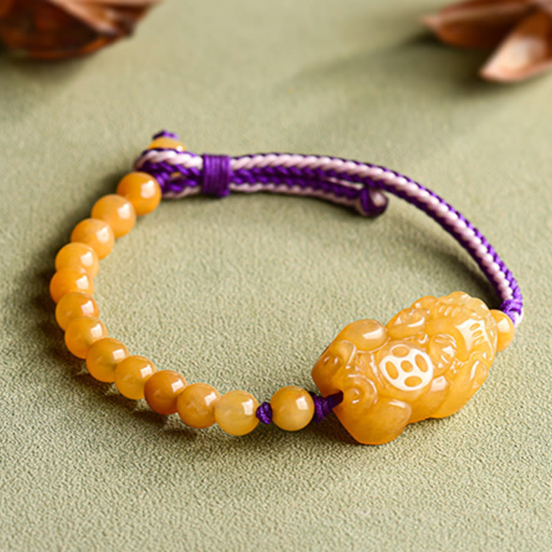 Golden Silk Jade PiXiu Wealth Bracelet – PiXiu carving detail close-up view, jade craftsmanship focus